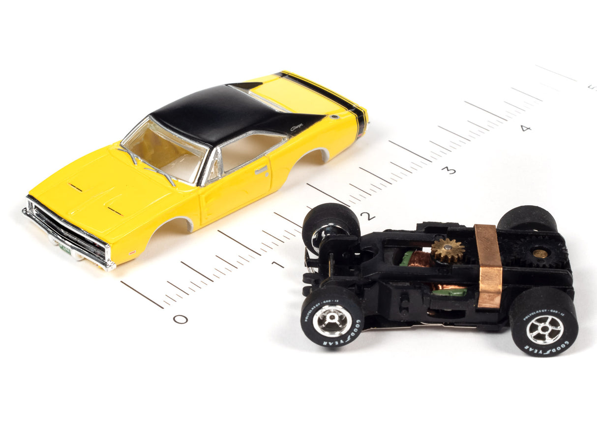 Yellow and black slot car muscle car model with visible undercarriage for Auto World SC354