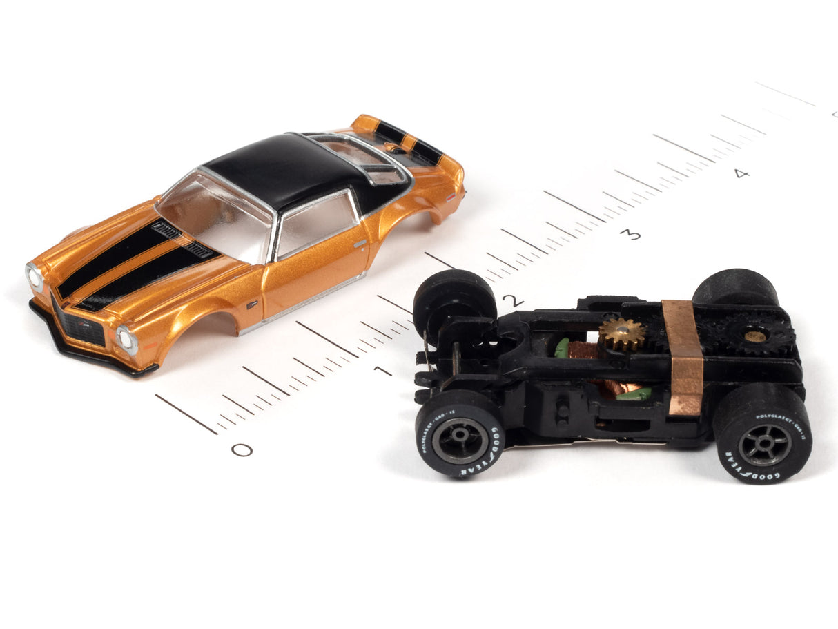 Gold and black slot car muscle car model with visible undercarriage for Auto World SC354