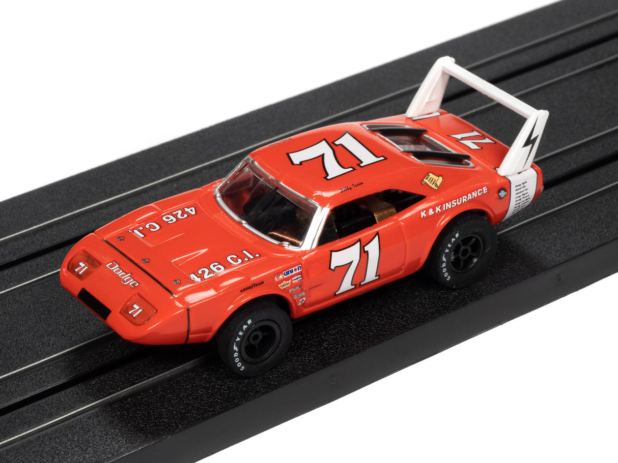 Red slot car stock car toy on a black track for Auto World SC355