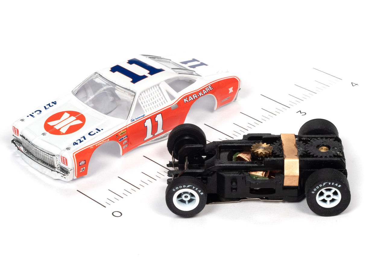 Slot car stock car model with open hood showing engine details for Auto World SC355