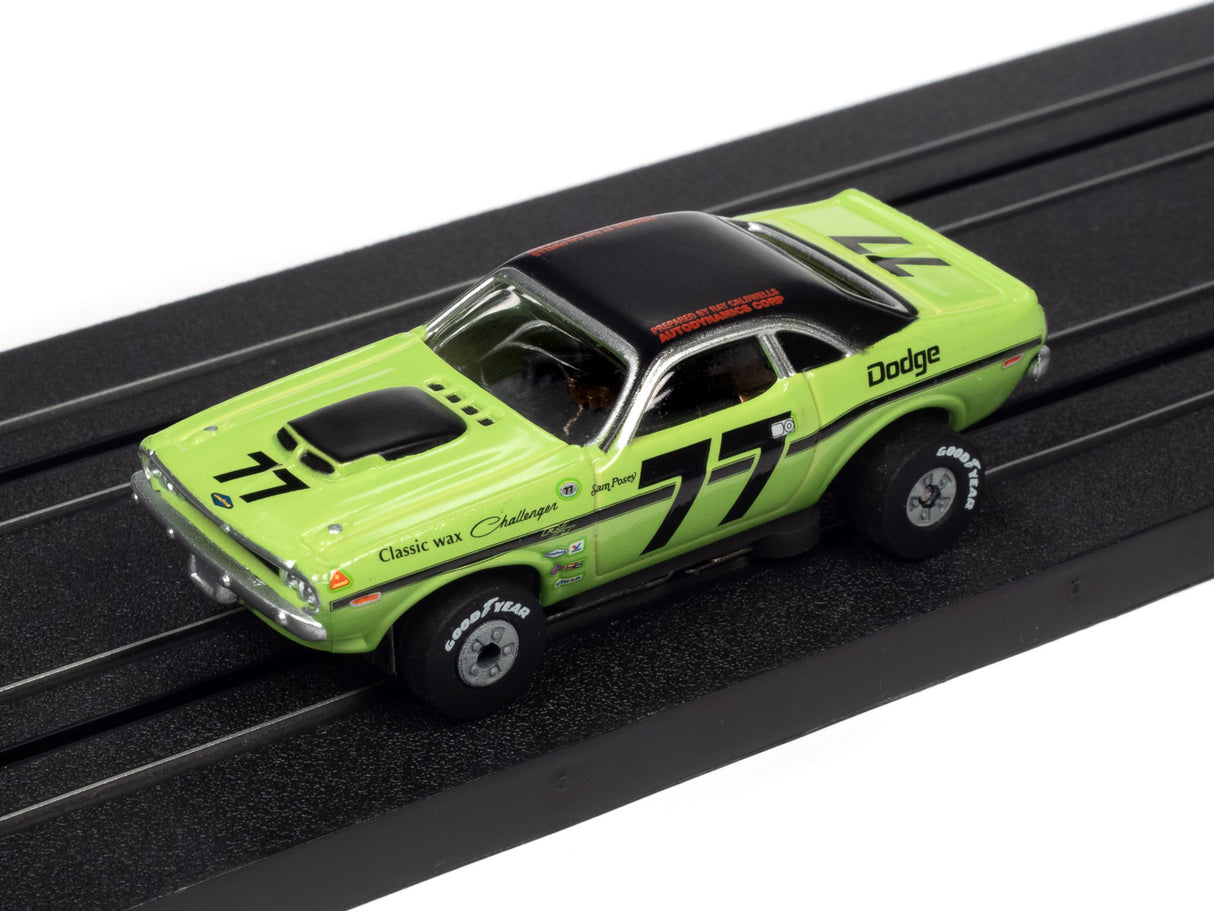 Green Dodge Challenger slot car on a black track for Auto World SC357
