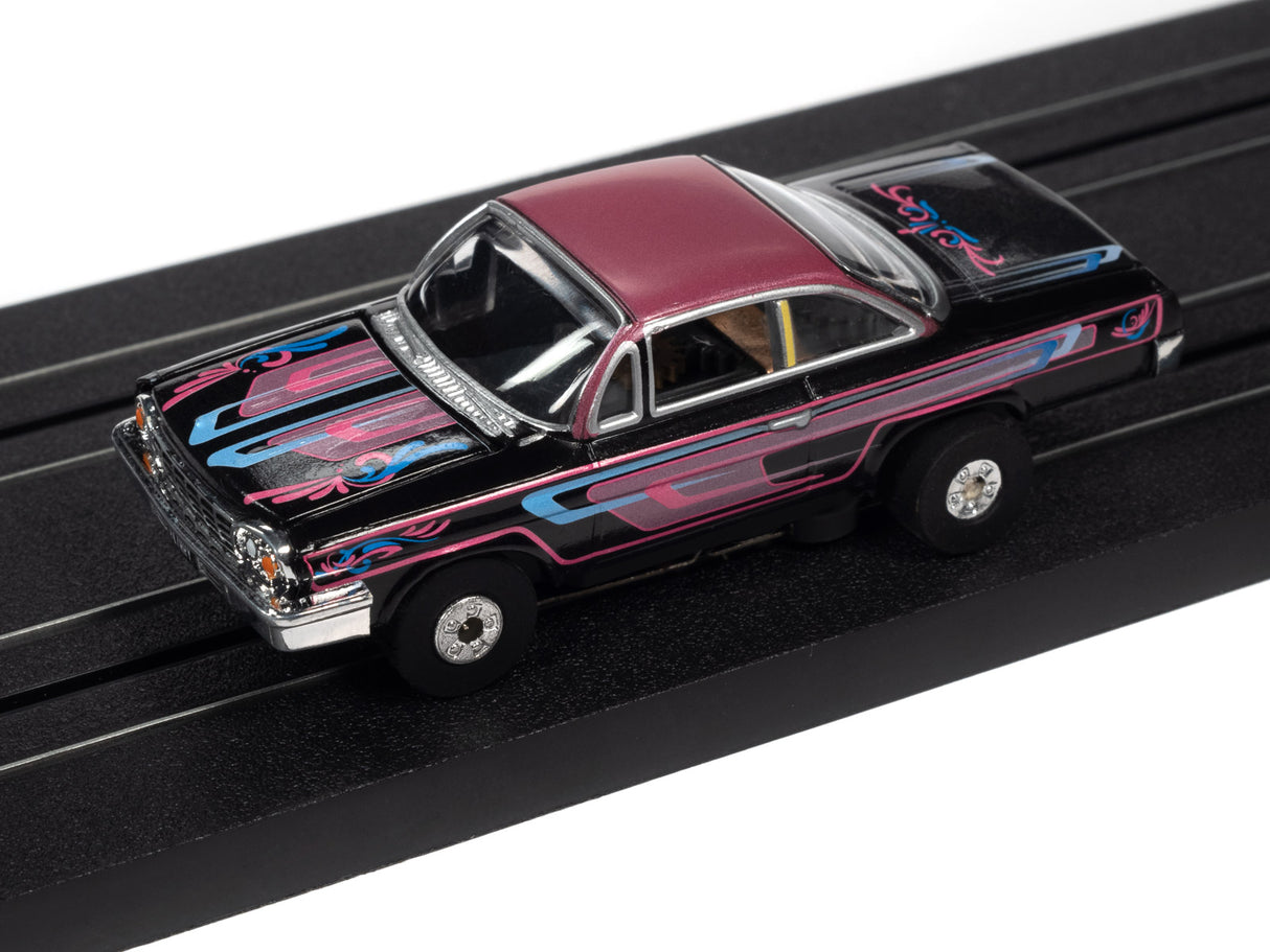 Black and maroon classic car slot car on a black track for Auto World SC360
