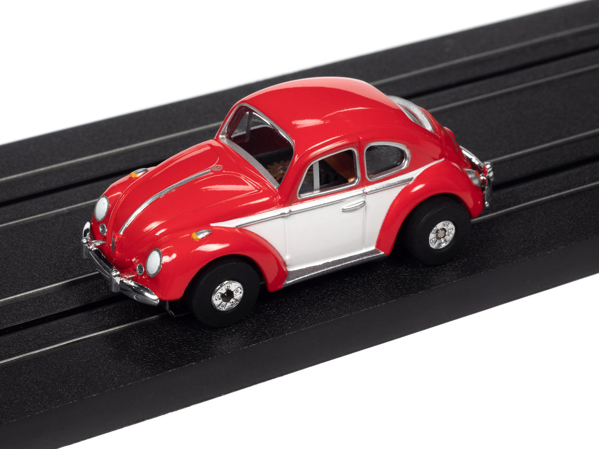 Red and white classic Volkswagen Beetle toy car on a black track for Auto World SC360