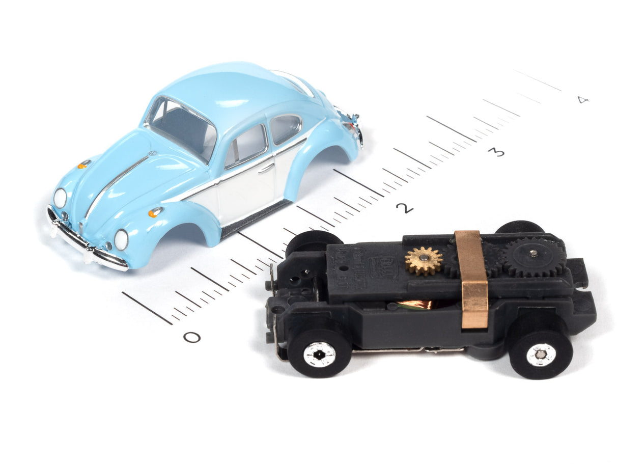 Blue classic car and black mechanical car on a ruler for Auto World SC360
