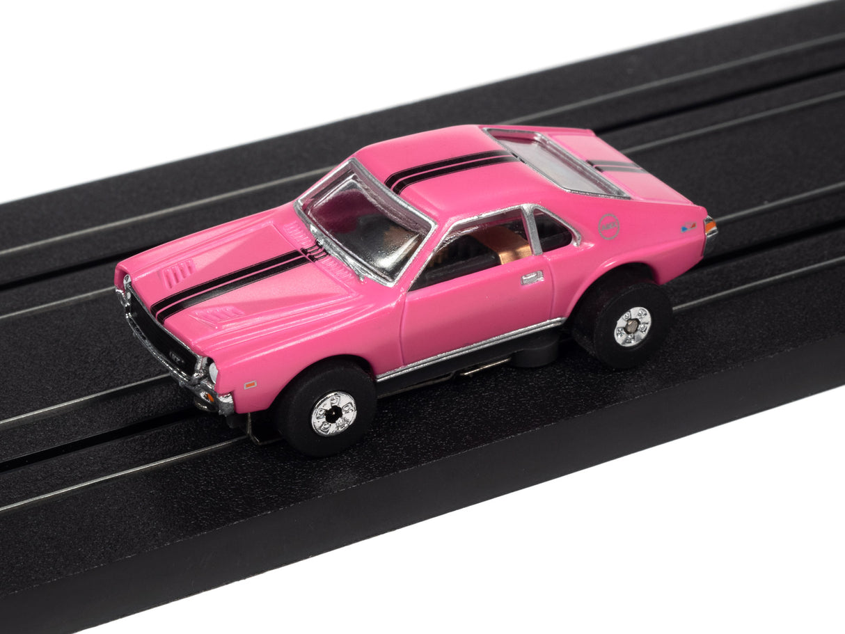 Pink slot car on a black track for Auto World SC360