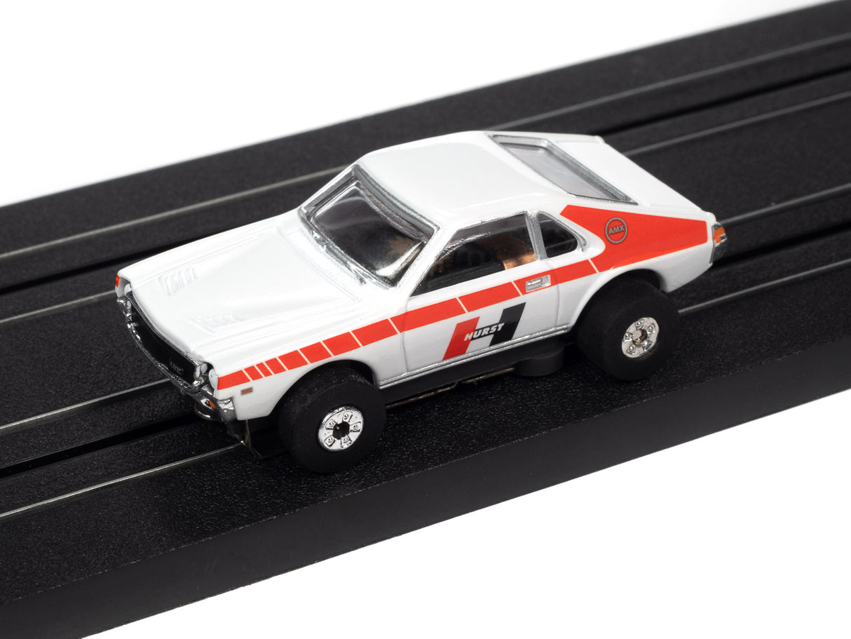 White and red slot car on a black track for Auto World SC360