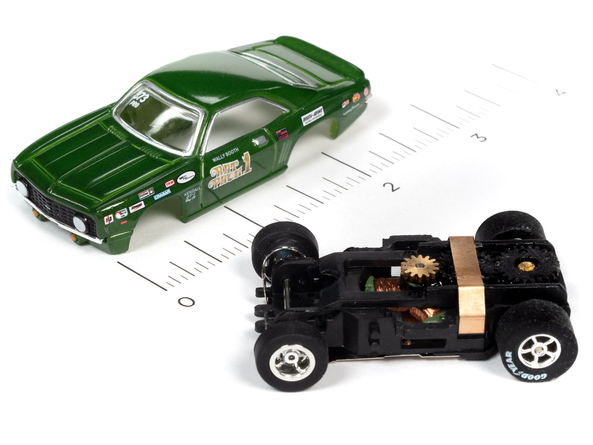 Green slot car and disassembled black race car chassis on white background for Auto World SC361