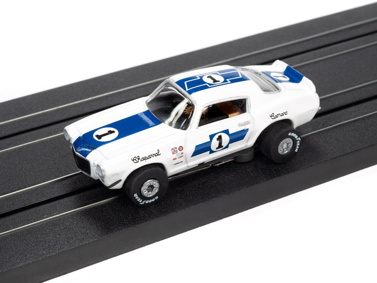 White and blue slot car race car on a track for Auto World SC362