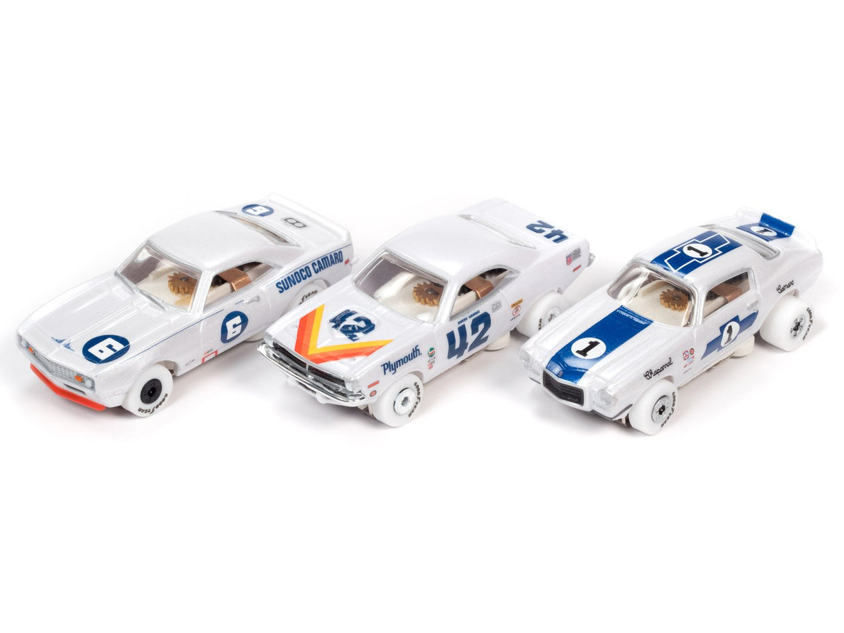 Three white slot car race cars lined up on a white background for Auto World Slot Cars SC362