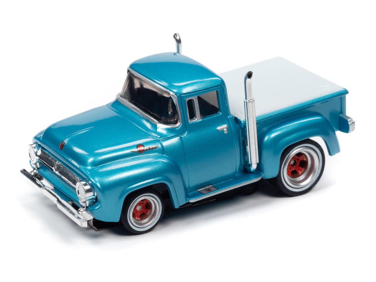 Aqua blue and white scale pickup truck model on white background for Auto World SRS331