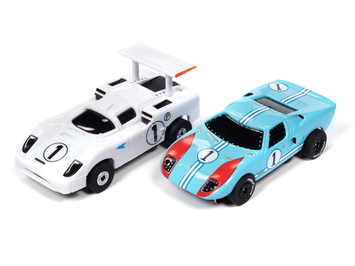 Two race car toys: one white, one blue and red for Auto World SRS333