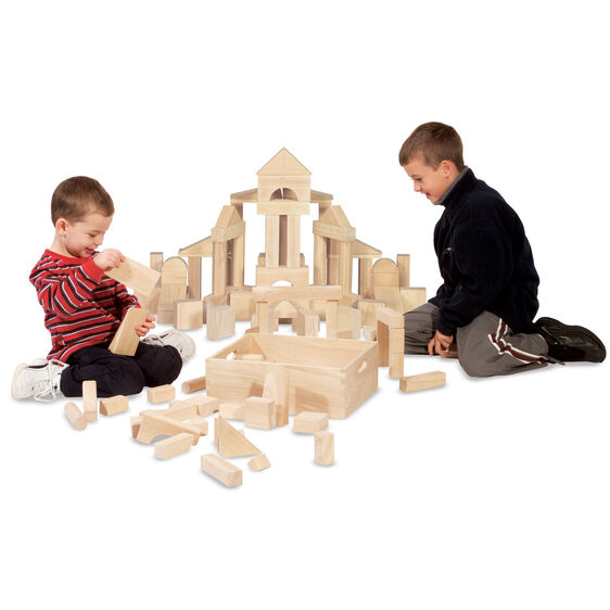 Boys building with wooden unit blocks to create a structure for Melissa and Doug 503