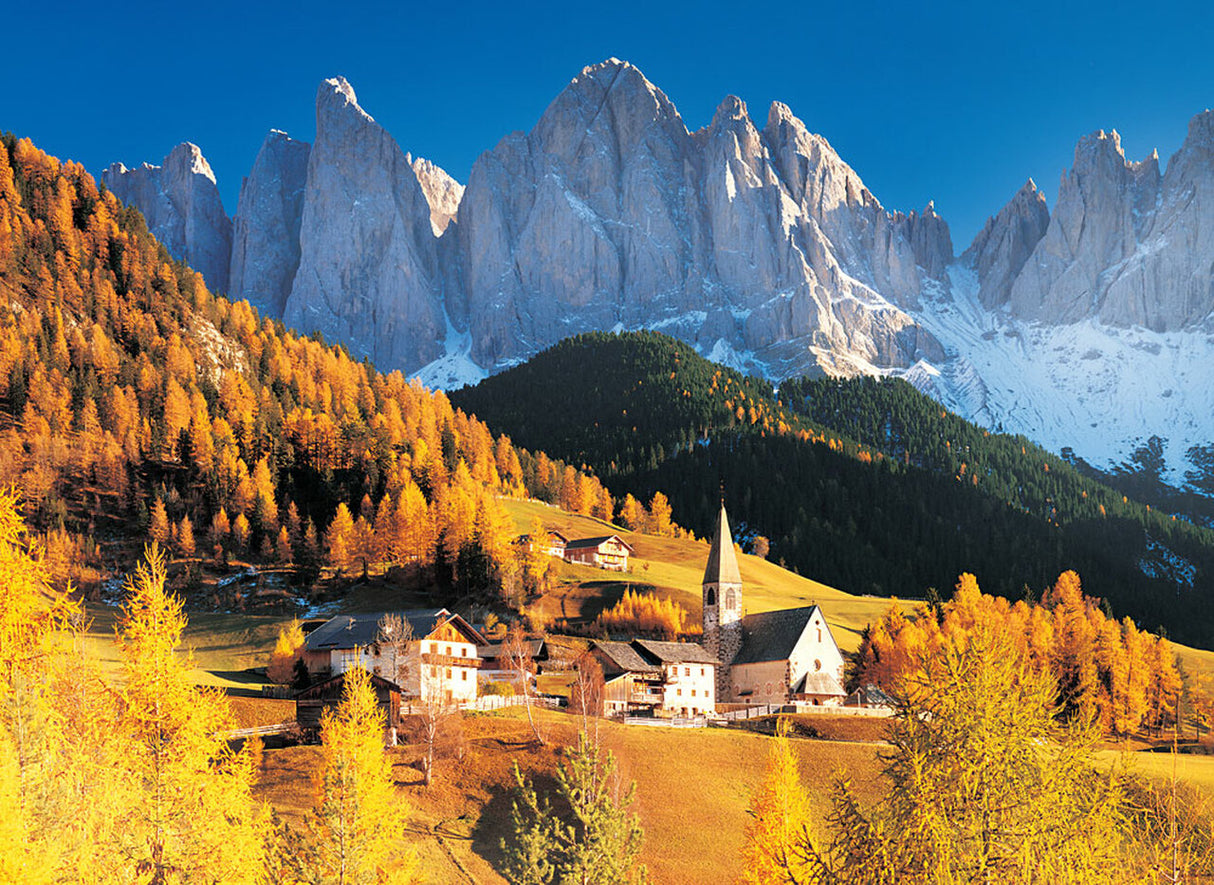 Alpine village nestled in golden autumn woods beneath towering Dolomite peaks for Tomax TOM50-054