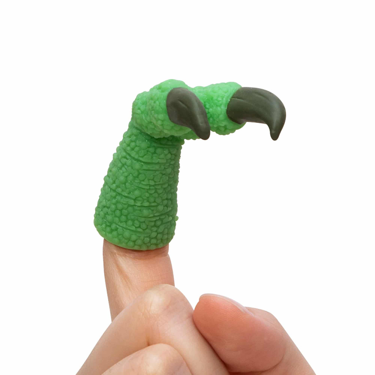 Green T-Rex arm toy held on a finger for Schylling TTA