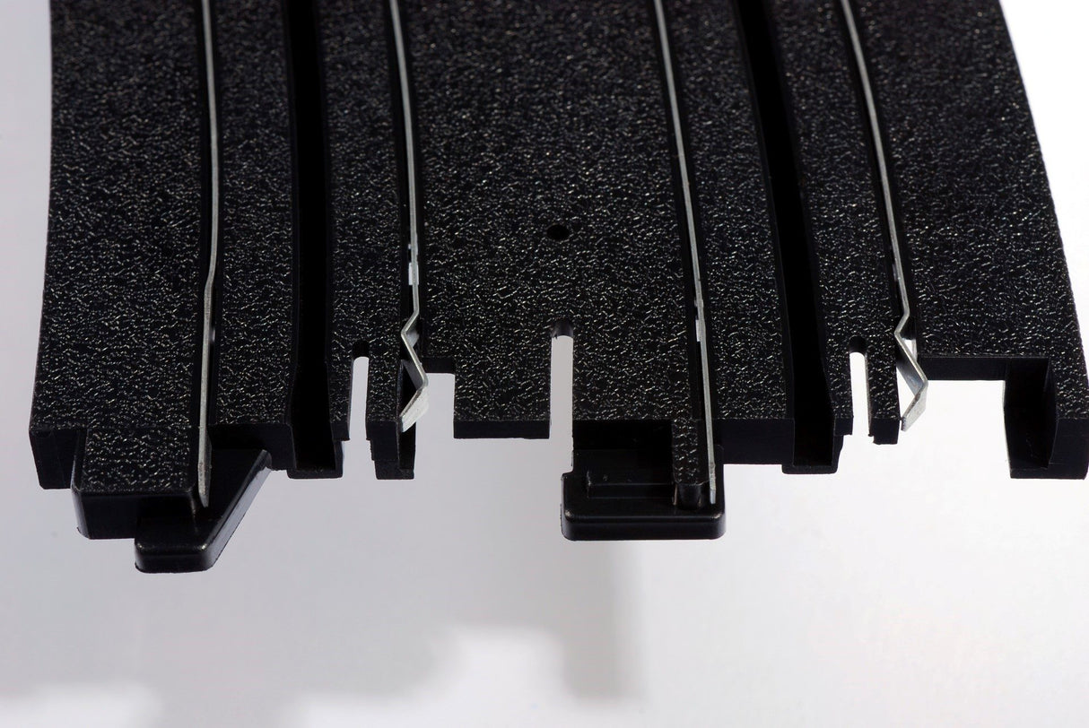 Black, curved racing skid plate with multiple mounting slots for AFX RaceMaster 70621