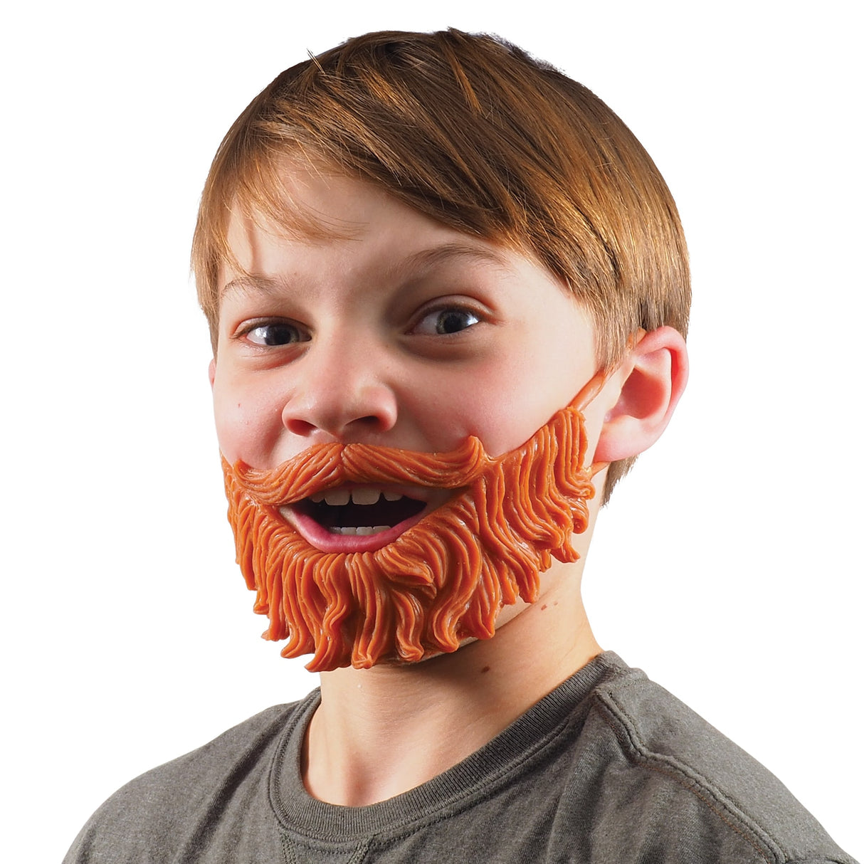 Young boy wearing a large, fake orange beard, smiling widely for Schylling WBD