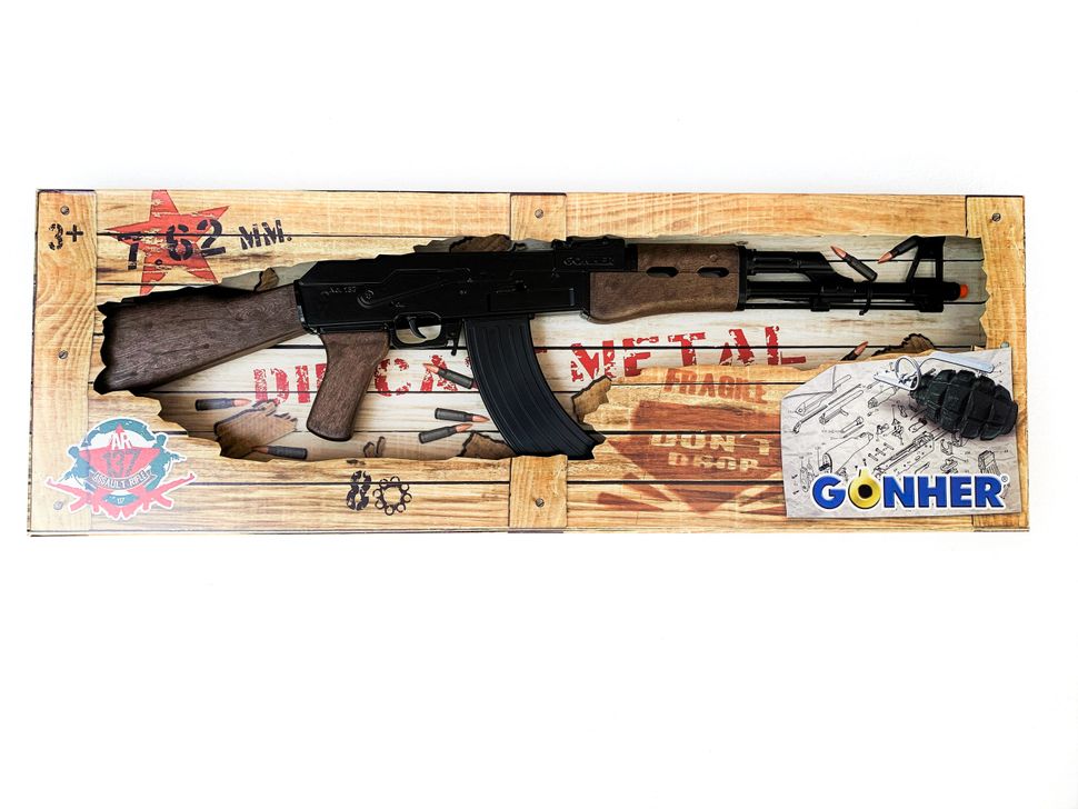 AK-47 assault rifle displayed on a wooden background with ammunition for Gonher 137/6