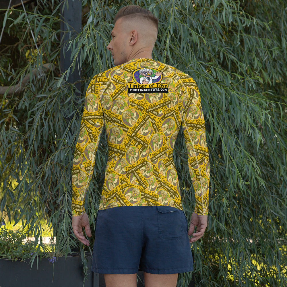 Man wearing a yellow, patterned rash guard and dark shorts outdoors for 9551523_9326, rear view