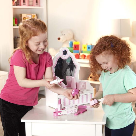 Two girls play with a beauty salon set, using play makeup and tools for Melissa and Doug 3026