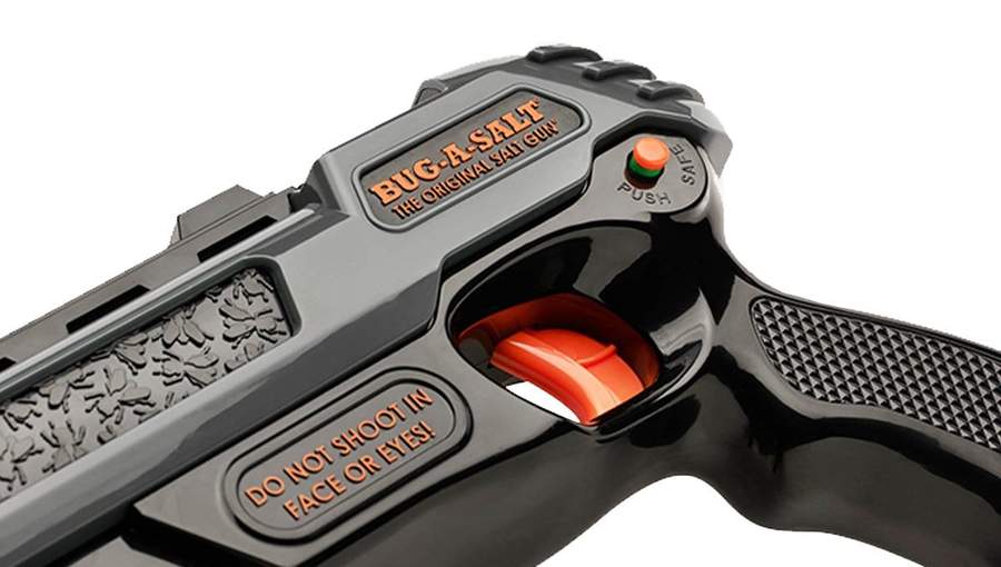 Black pepper spray gun with safety and warning markings visible for Bug-A-Salt BS63-SG