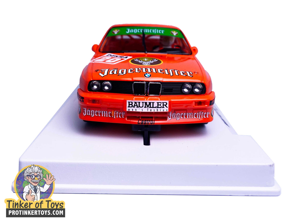 Orange BMW M3 E30 slot car model on a white base for Fly Car Biker’s In Car 01