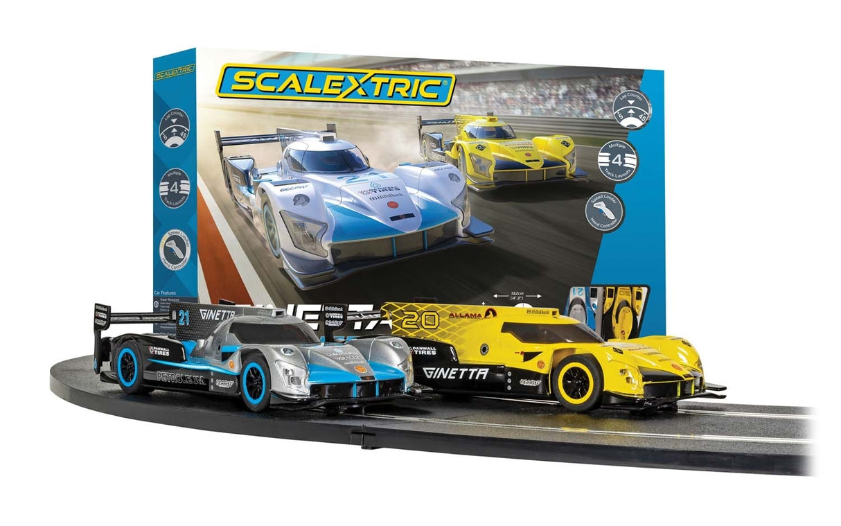 Two Ginetta race cars on a track display set for Scalextric C1412