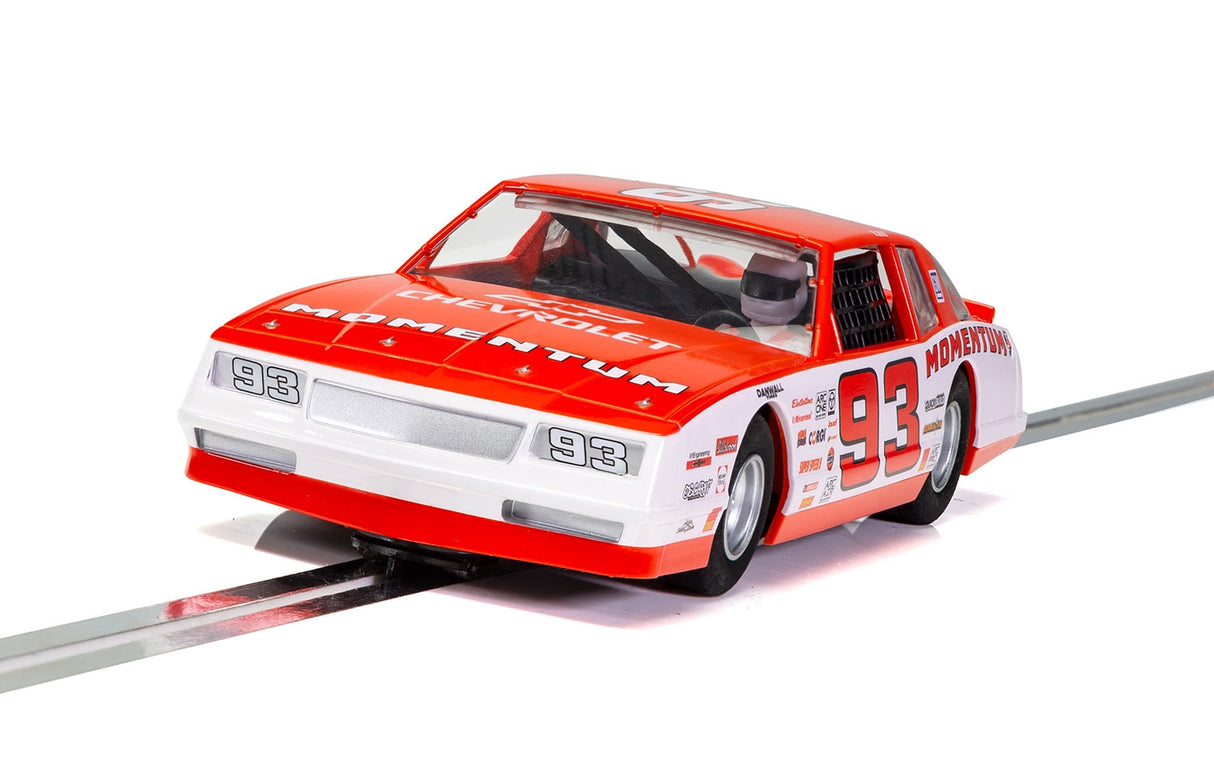 Red 1/32 scale slot car of a 1986 Chevrolet Monte Carlo race car for Scalextric 1/32 Slot Cars C3949, side view