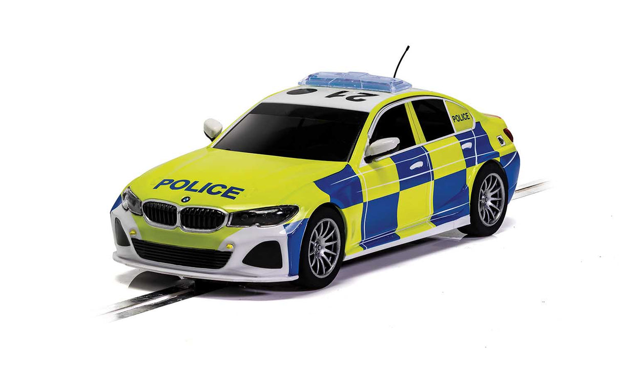 Yellow and blue police car model on a track for Scalextric C4165T