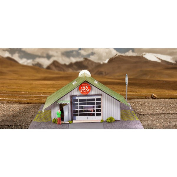 Model kit of a hot rods garage in a scenic, open landscape setting for Innovative Hobby Supply BK4810