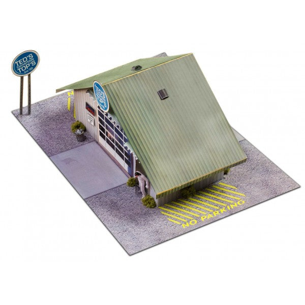Model kit of a commercial steel garage with a "Ted's" sign for Innovative Hobby Supply BK3210