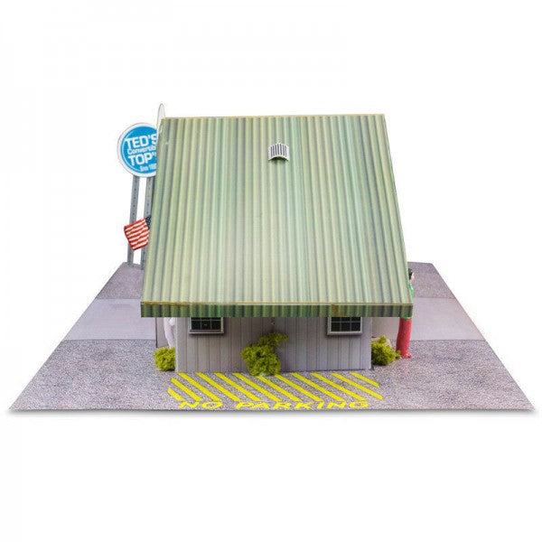 Model kit of a commercial steel garage with a light green sloped roof for Innovative Hobby Supply BK3210