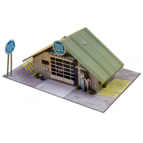 Model kit of a small, detailed garage building with signage for Innovative Hobby Supply BK3210