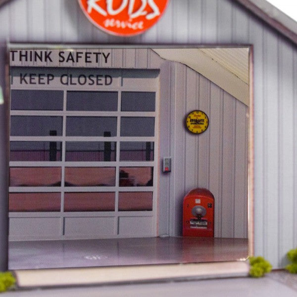 Garage door with "THINK SAFETY KEEP CLOSED" sign and vintage details for Innovative Hobby Supply BK4810