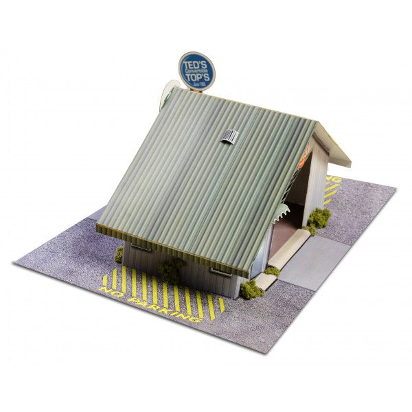 Model kit of a commercial steel garage with a sign for Innovative Hobby Supply BK4810