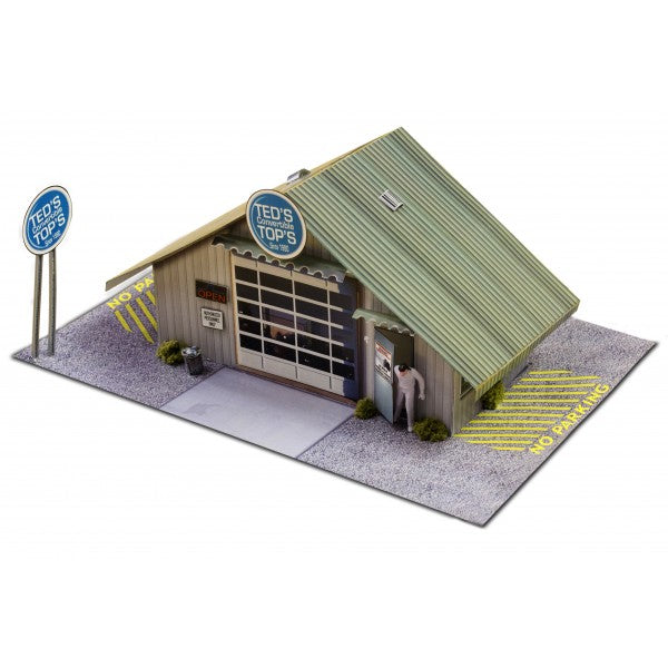 Model kit of a small, detailed garage building with signage for Innovative Hobby Supply BK4810