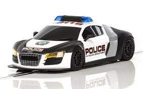 Black and white police car model with flashing lights for Scalextric C3932