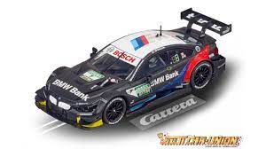 Black and white BMW race car model on a slot car track for Carrera 20025239