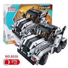 Two black and white brick RC trucks, one transforming into the other for Qihui QIH08018