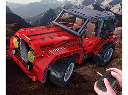 Red RC car model on dirt terrain with remote controller nearby for Qihui QIH08017