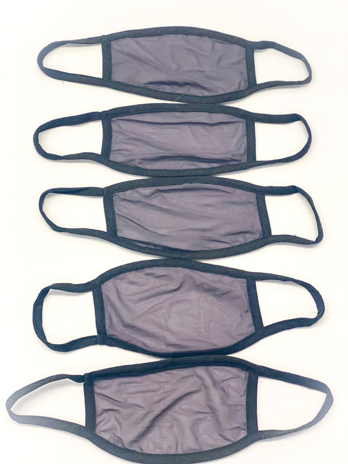 Five black and gray disposable face masks with ear loops for Fake Mask USA