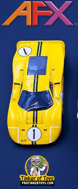 Yellow race car toy, Ford GT40 Mark IV #1, with blue accents for AFX/Racemasters 22025