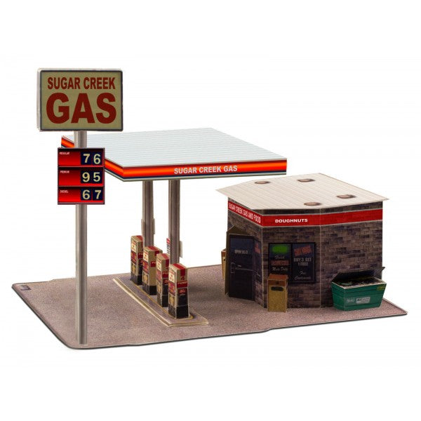 Model kit of a gas station with pumps, canopy, and convenience store for Innovative Hobby Supply BK3208