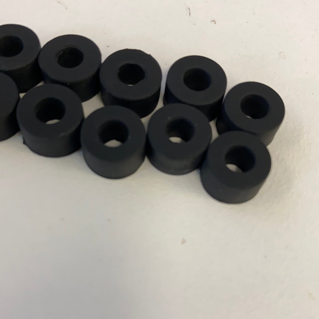 Ten black slot car rear tires arranged in a row for Auto World CP7911