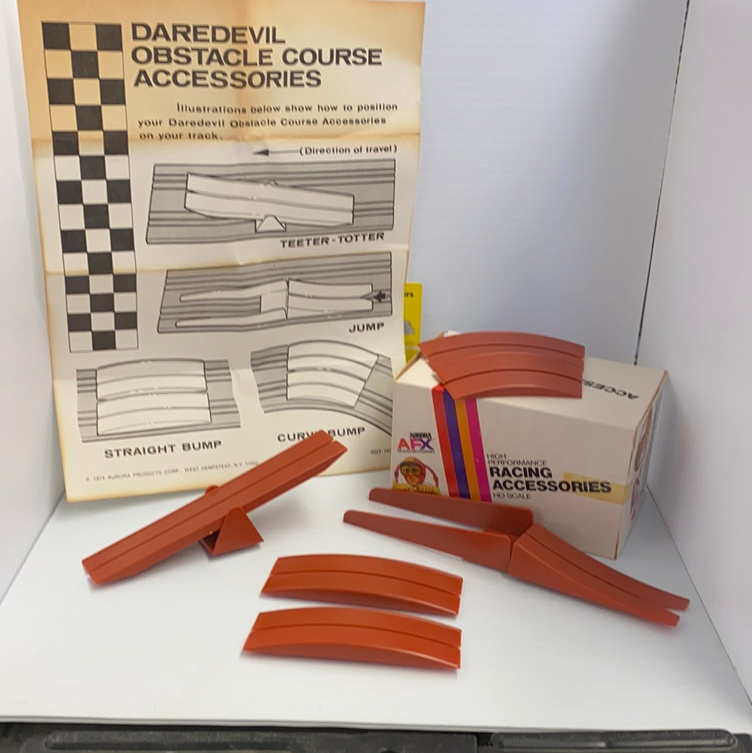 Vintage Daredevil obstacle course accessories with instructions and orange plastic pieces for Aurora AFX Vintage 1593