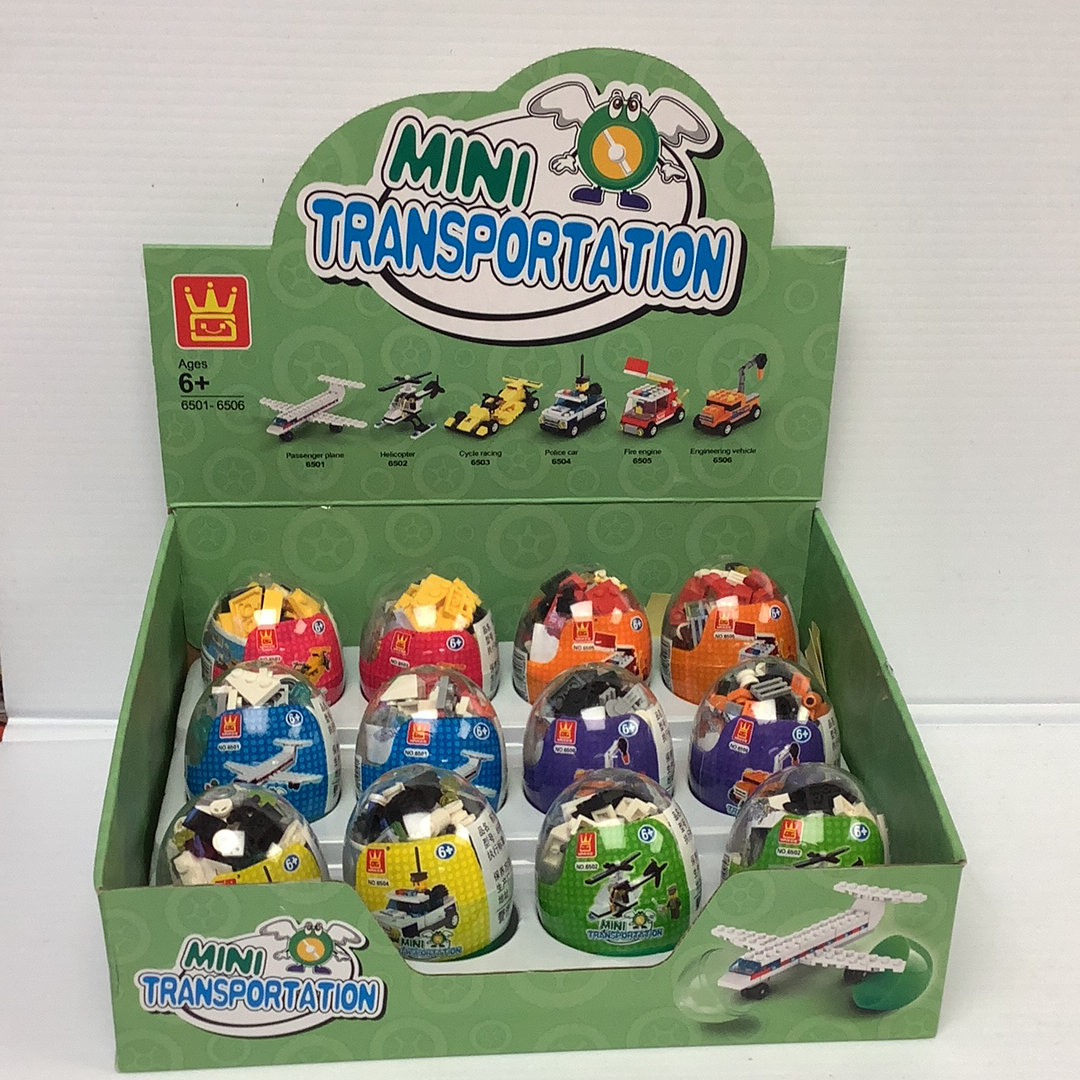 Assortment of mini vehicle toys in a green cardboard display box for IMEX Model Company WAG65016