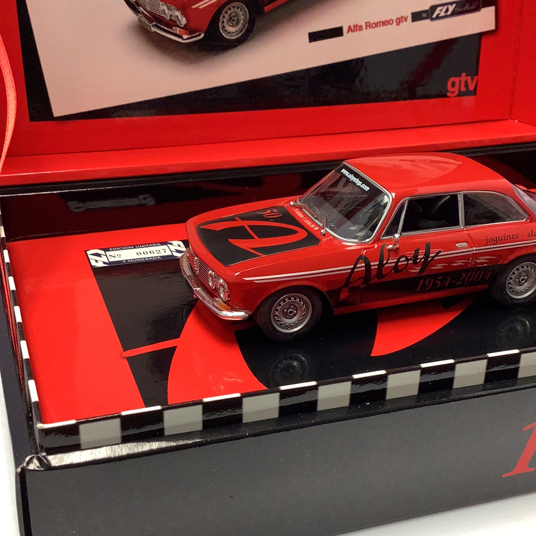 Red Alfa Romeo Giulia GTV slot car in its display box for Fly Slot Car 96061