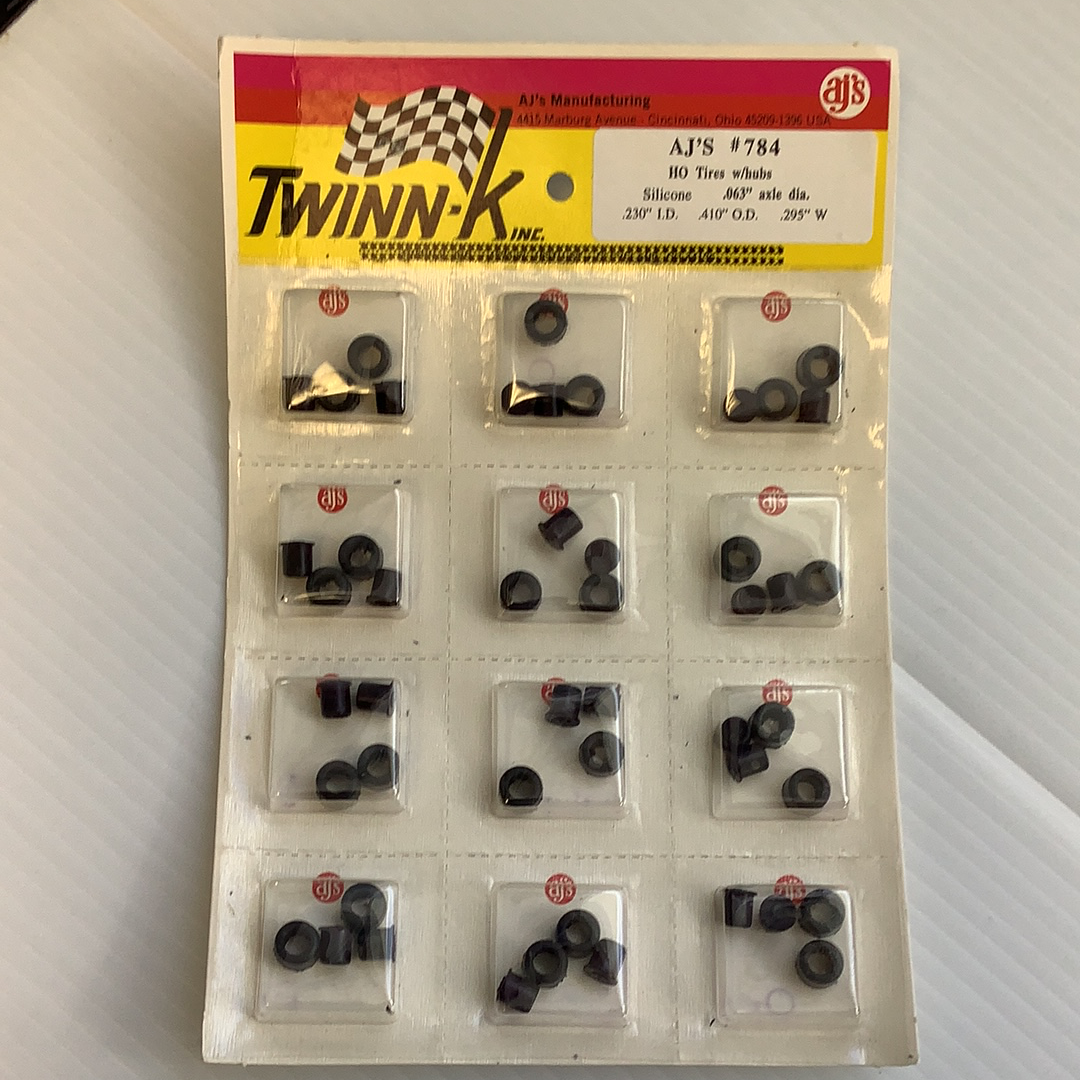 Assortment of model train wheels and hubs in plastic packaging for HO Tires w/hubs Silicone .063”axle dia 784