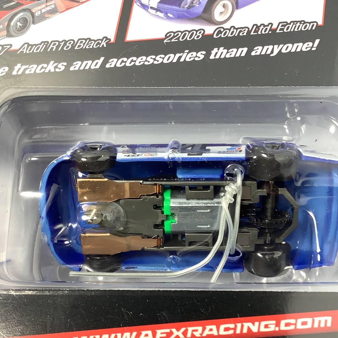 Blue and black remote control car chassis in clear plastic packaging for AFX/Racemasters 22041
