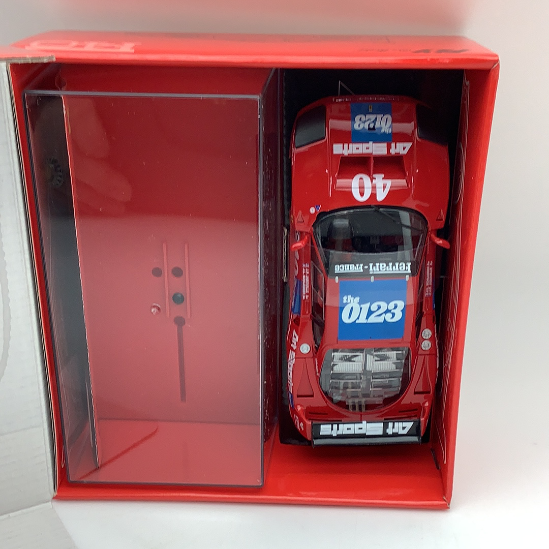 Red display case with a model Ferrari F40 race car inside for Fly Car 88283