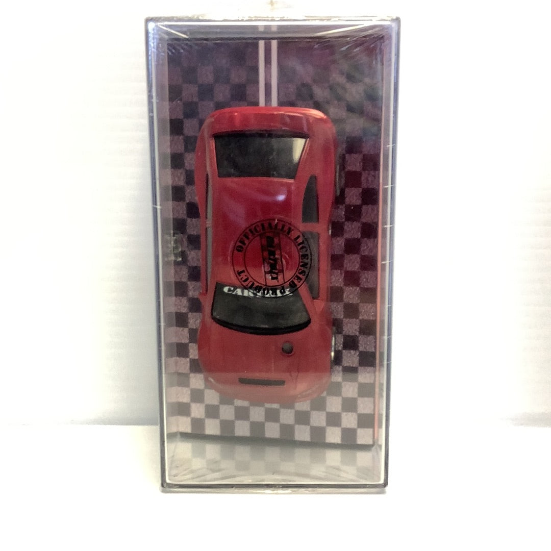 Red slot car in a display case for CARTRIX 0312E